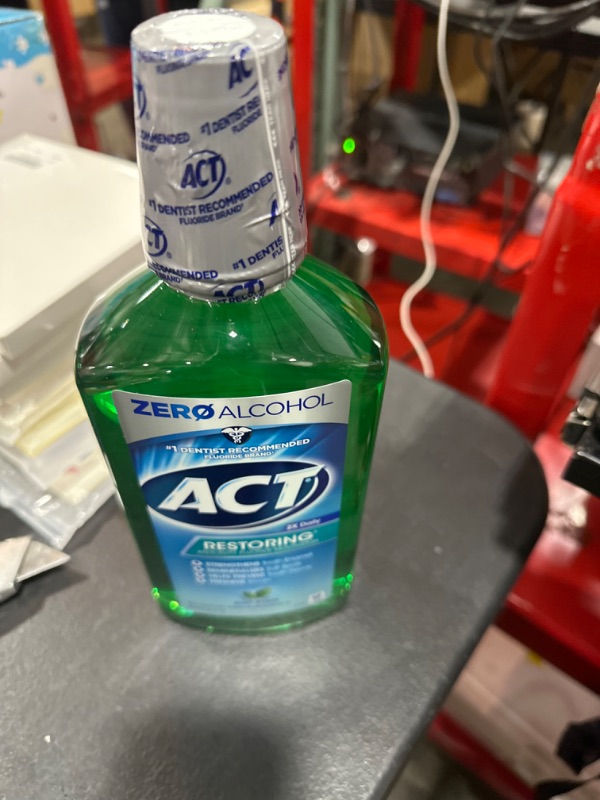 Photo 2 of ACT Restoring Zero Alcohol Fluoride Mouthwash 33.8 fl. oz. Strengthens Tooth Enamel, Mint Burst Green 33.8 Fl Oz (Pack of 1)