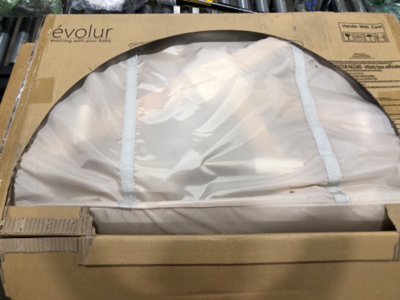 Photo 2 of Evolur Stellar Bassinet and Bedside Sleeper, Easy to Fold and Carry, Lightweight and Portable Baby Bassinet, Height Adjustable, Mattress Pad Included, Beige