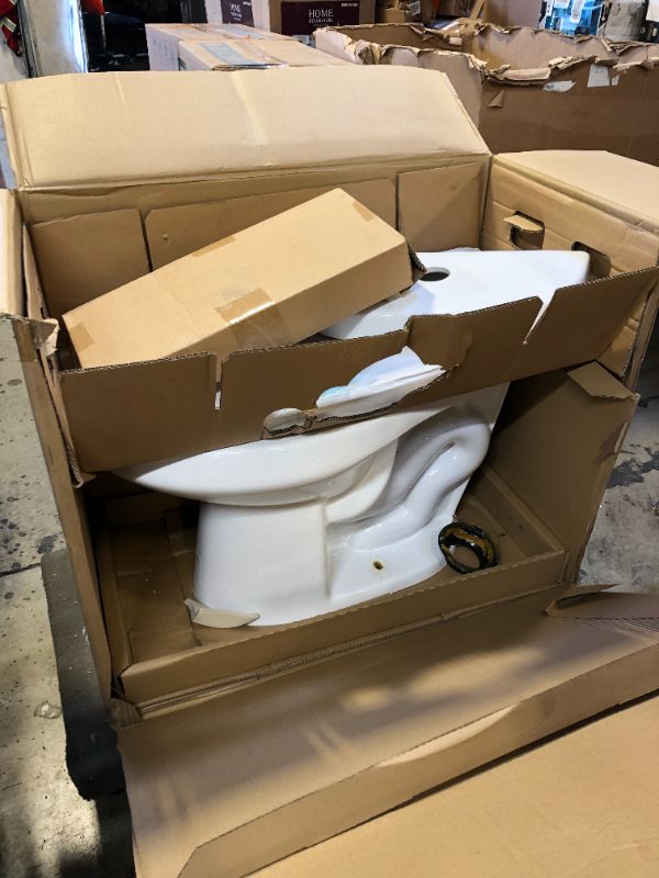 Photo 2 of 2-piece 1.1 GPF/1.6 GPF High Efficiency Dual Flush Complete Elongated Toilet in White, Seat Included