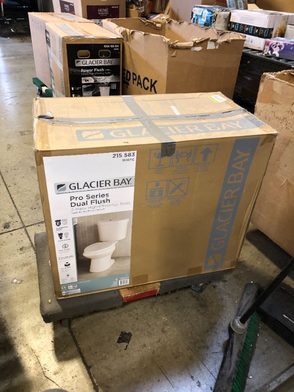 Photo 1 of 2-piece 1.1 GPF/1.6 GPF High Efficiency Dual Flush Complete Elongated Toilet in White, Seat Included