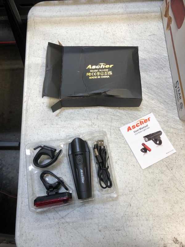 Photo 1 of Ascher Ultra Bright USB Rechargeable Bike Light Set, Powerful Bicycle Front Headlight and Back Taillight, 4 Light Modes, Easy to Install for Men Women Kids Road Mountain Cycling Black
