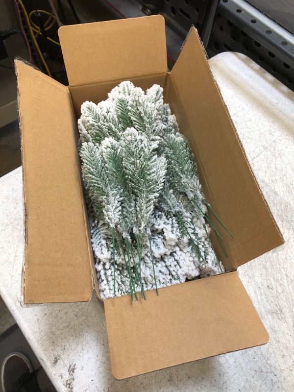 Photo 2 of 30 Pcs Snow Frosted Pine Branches Christmas Artificial Pine Leaves Branches Fake Greenery Plants Pine Sprigs Green Christmas Tree Picks Faux Greenery Stems for DIY Garland Crafts Winter Decorations
