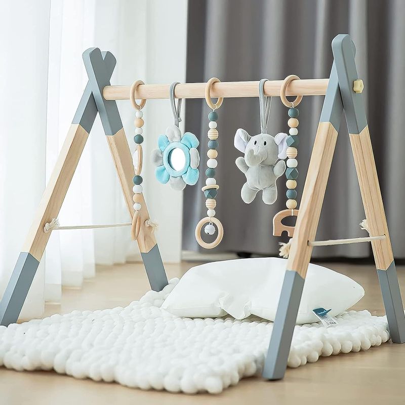 Photo 1 of Avrsol Wooden Baby Play Gym Foldable Baby Play Gym Frame Activity Gym Hanging Bar with 5 Gym Baby Toys Natural Gift for Newborn Baby (Foldable Grey)
