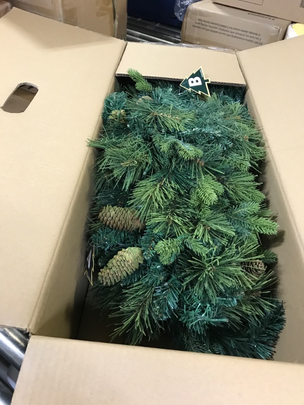 Photo 1 of 7.5 ft. Prelit Artificial Christmas Tree with Pine Cones, Foot Pedal, 1556 Branch Tips, 750 Warm Lights and Metal Stand
