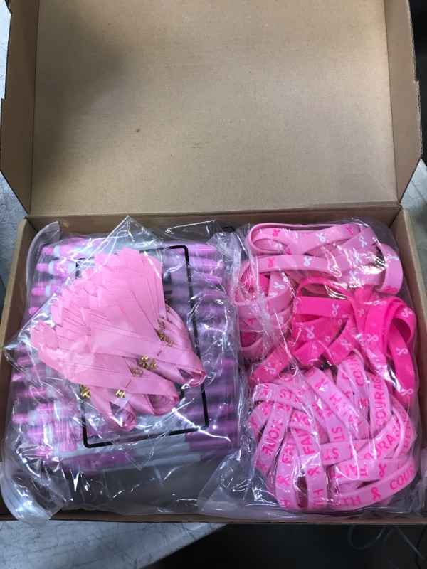 Photo 2 of Kigeli 216 Pcs Breast Cancer Awareness Accessories, 72 Pcs Breast Cancer Bracelets Pink Ribbon Rubber Wristbands 72 Pcs Breast Cancer Pins 72 Pcs Awareness Ribbon Pen for Breast Cancer Themed Events