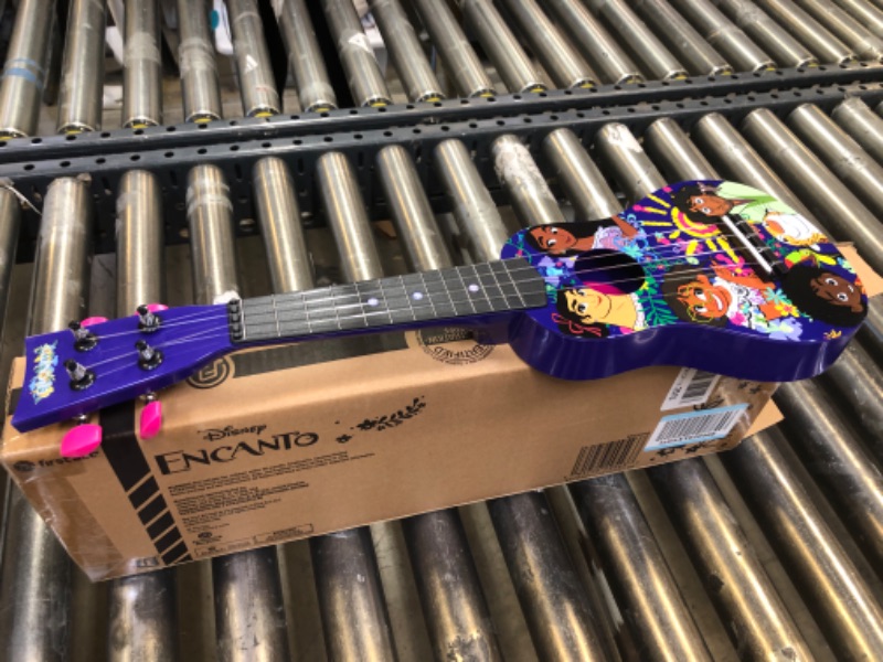 Photo 2 of First Act Discovery Encanto Ukulele - 20-Inch Soprano Uke - Ukulele for Beginners - Musical Instruments for Toddlers and Preschoolers - Ready to Play - Make Learning to Play Music Easy and Fun