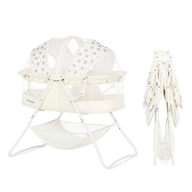 Photo 1 of Dream On Me Karley Bassinet in French White, Lightweight Portable Baby Bassinet, Quick Fold and Easy to Carry , Adjustable Double Canopy, Indoor and Outdoor Bassinet with Large Storage Basket.
