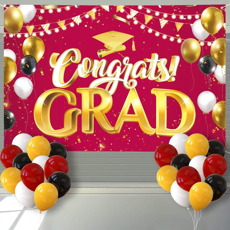 Photo 1 of Arosche Extra Large Graduation Banner Decorations 72" x 48" Backdrop with 24Pcs Balloons Congrats Grad Photography Background for Indoor Outdoor College,Garden,Yard,Party Supplies (Maroon)
