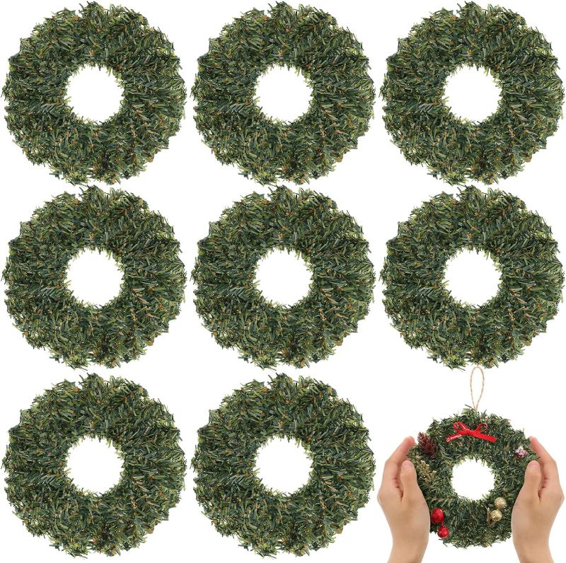 Photo 1 of Yuxung 8 Pcs Mini Christmas Wreath Artificial Wreaths for Christmas Decorations Holiday Pine Wreaths for Xmas Holiday New Year Door Home Window Party Decorations, 6 inch
