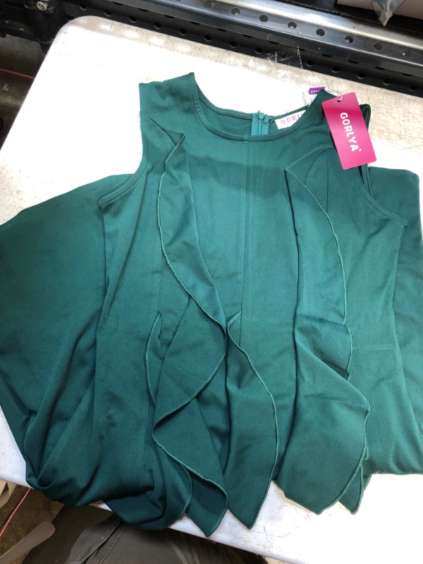 Photo 1 of girls dress green-= short sleeve
size- 14 y