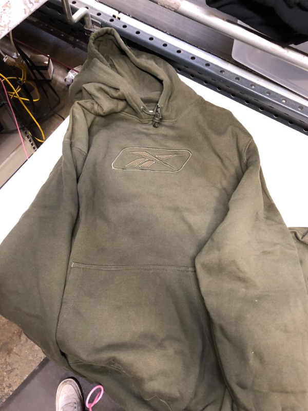 Photo 1 of green reebok hoodie size large 