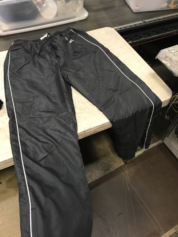 Photo 1 of WOMENS TRACK PANTS 
SIZE LARGE 