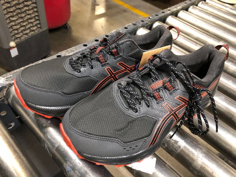 Photo 1 of ASIC'S MENS 9.5, BLACK AND ORANGE 