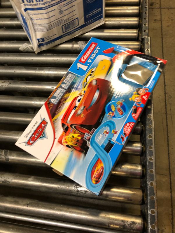 Photo 3 of Carrera First Disney/Pixar Cars - Slot Car Race Track - Includes 2 Cars: Lightning McQueen and Dinoco Cruz - Battery-Powered Beginner Racing Set for Kids Ages 3 Years and Up Disney Cars w/ Spinners