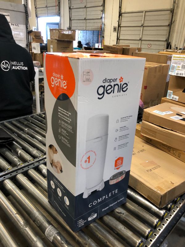 Photo 1 of Diaper Genie Complete Diaper Pail (Pink) with Antimicrobial Odor Control | Includes 1 Diaper Trash Can, 1 Refill Bags, 1 Carbon Filter Pink Pail + 1 Refill