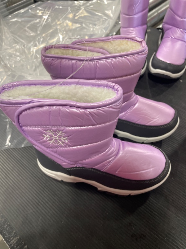 Photo 1 of KIDS PINK SNOW BOOTS 