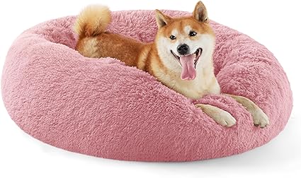 Photo 1 of Bedsure Calming Dog Bed for Medium Dogs - Donut Washable Medium Pet Bed, 30 inches Anti Anxiety Round Fluffy Plush Faux Fur Cat Bed, Fits up to 45 lbs Pets, Pink 30x30x8 Inch (Pack of 1) Pink