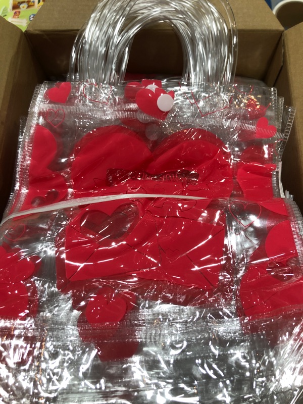 Photo 2 of 100 Pcs Valentines Clear Plastic Gift Bags with Handles Clear PVC Heart Bags Reusable Wrap Tote Bags Valentine's Day Gift Party Favor Bags with Ribbon for Valentines Wedding Birthday Favors