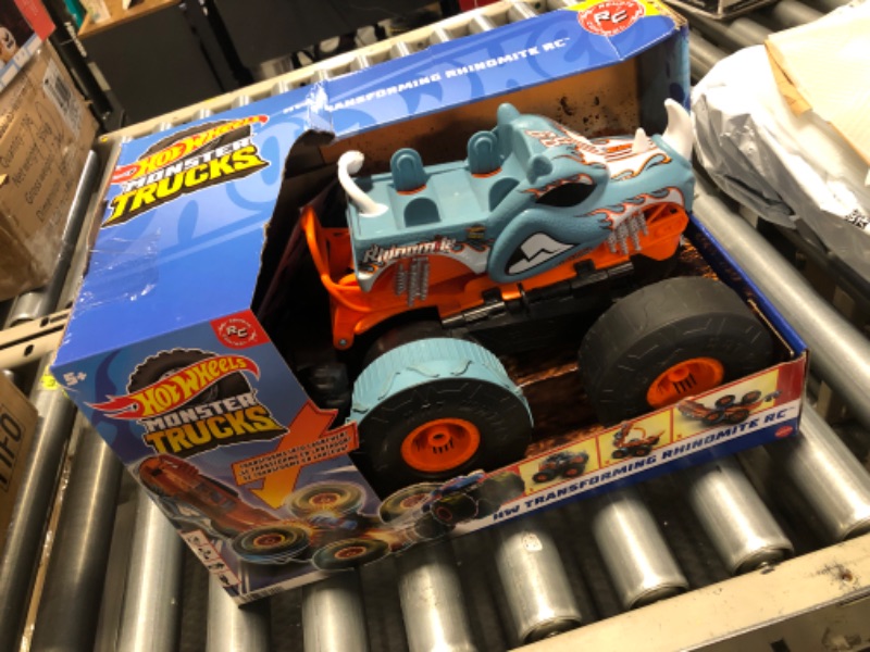 Photo 1 of Hot Wheels Monster Trucks HW Transforming Rhinomite RC in 1:12 Scale with 1:64 Scale Race Ace Toy Truck, Converts into Launcher, Connects to Orange Track