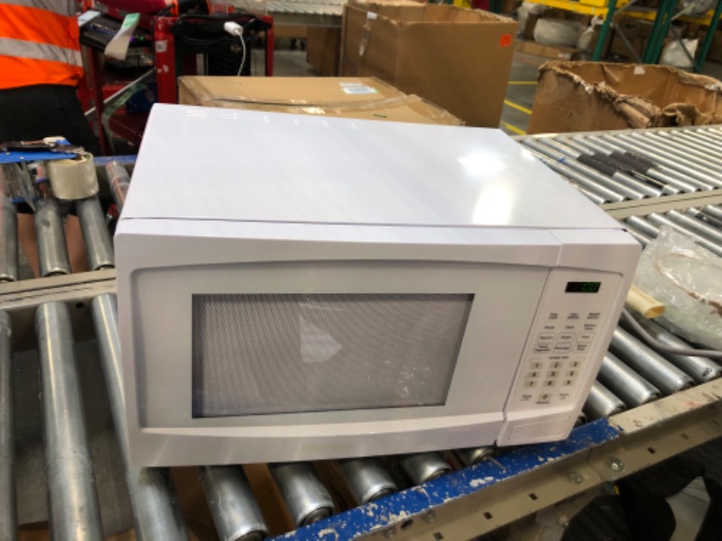 Photo 5 of Danby DBMW1120BWW 1.1 Cu.Ft. Countertop Microwave In White - 1000 Watts, Family Size Microwave With Push Button Door