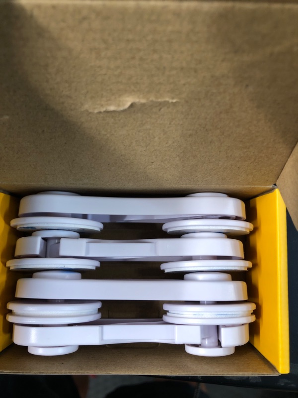 Photo 1 of Cabinet Locks - Adoric Life Child Safety Locks 4 Pack - Baby Safety Cabinet Locks - Baby Proofing Cabinet Kitchen System with Strong Adhesive Tape White-4pc