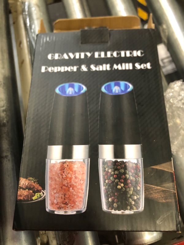 Photo 2 of ***HAS SCRATCHES*** 
Gravity Electric Pepper and Salt Grinder Set, Adjustable Coarseness, With LED Light, One Hand Automatic Operation, Stainless Steel Black, (2 Pack Black)
