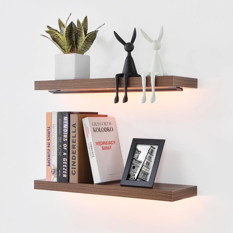 Photo 1 of EUREKA ERGONOMIC Floating Shelves with LED Lights, APP Control Light Dimmable Wall Mounted Display Shelf for Bedroom, Kitchen, Living Room, Gaming Room Decor, 24" W x 7" D - Set of 2 - Walnut Color****USED**** 
