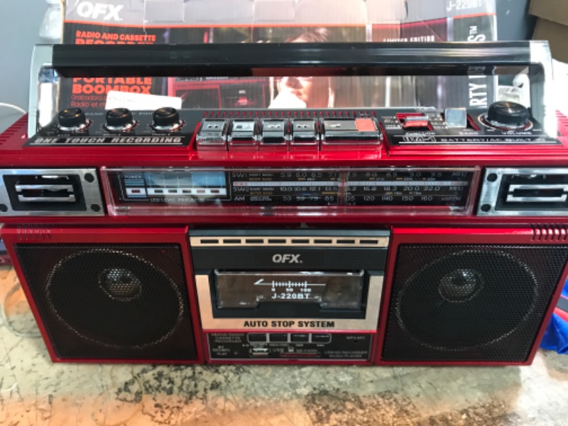 Photo 2 of QFX J-220BT Red Boombox MP3 Conversion from Radio to Cassette with 4-Band (AM, FM, SW1, SW2) Radio with Bluetooth, Dual 3” Speakers, Built-in Microphone, Recorder, and a 3-Band Equalizer