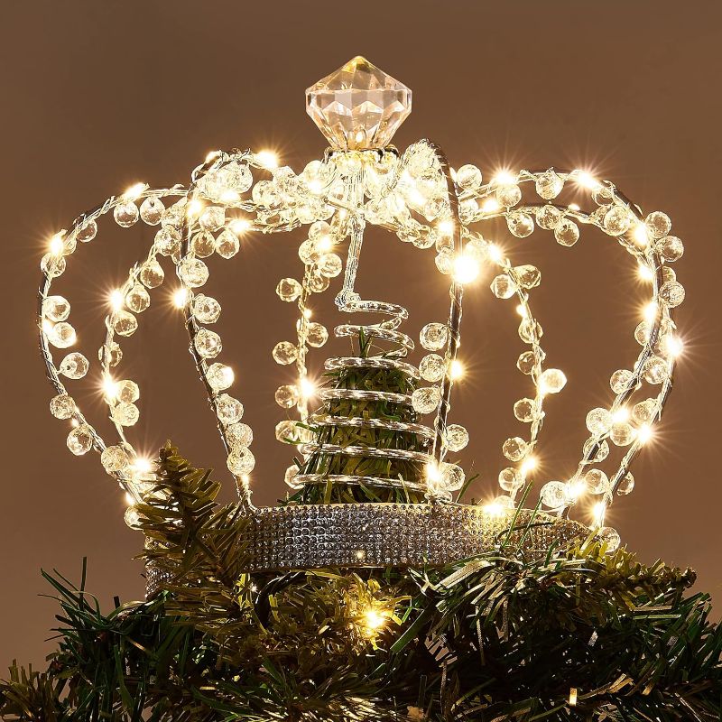 Photo 1 of PEIDUO Christmas Jeweled Crown Tree Topper, Light up Tree Topper with 60 Warm White Lights, Large Christmas Topper Unique with Multifunction Controller, Metal Xmas Topper Decorations for Tree, Plug in