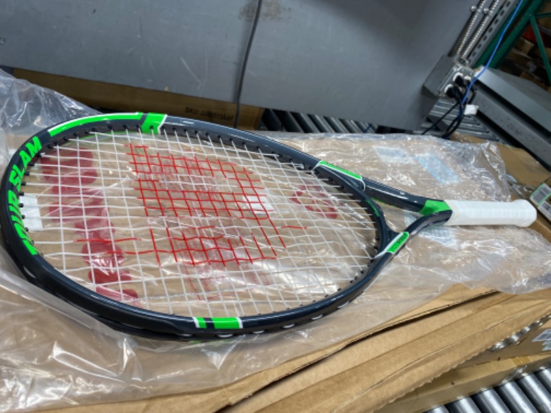 Photo 2 of ***DAMAGED - STRINGS BROKEN***
WILSON Adult Recreational Rackets Tennis' Grey/Green Grip Size 2 - 4 1/4" Tour Slam Racket