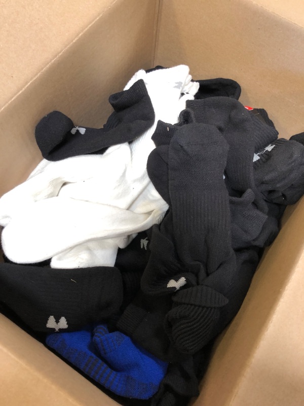 Photo 1 of Miscellaneous sized Under Armor Branded Socks, Approximately 30-50 pairs total, various colors