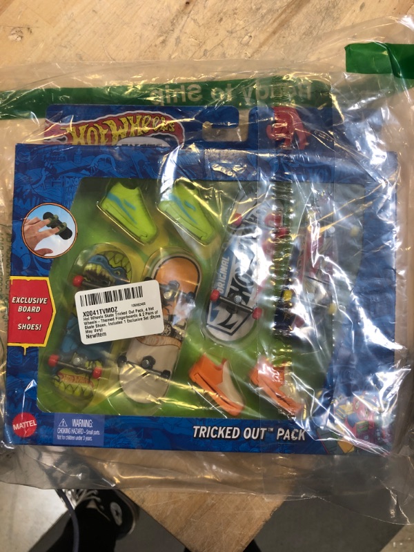 Photo 1 of Hot Wheels Skate Tricked Out Pack, 4 Hot Wheels-Themed Fingerboards & 2 Pairs of Skate Shoes, Includes 1 Exclusive Set (Styles May Vary)