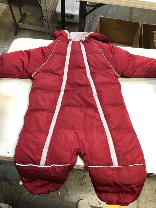 Photo 1 of kids red and grey zip up snow suit size 100