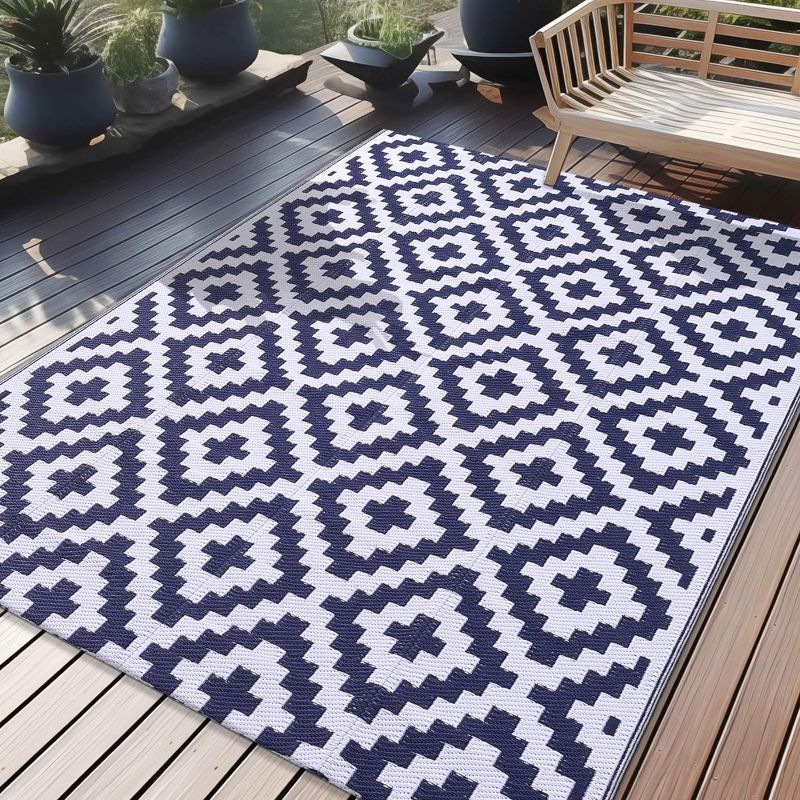 Photo 1 of OLANLY Waterproof Outdoor Rug 5x8 ft, Reversible Plastic Straw Patio Rug for Camping, RV Mat Outside, Indoor Outdoor Carpet for Porch, Deck, Backyard, Camper, Balcony, Picnic, Navy & White