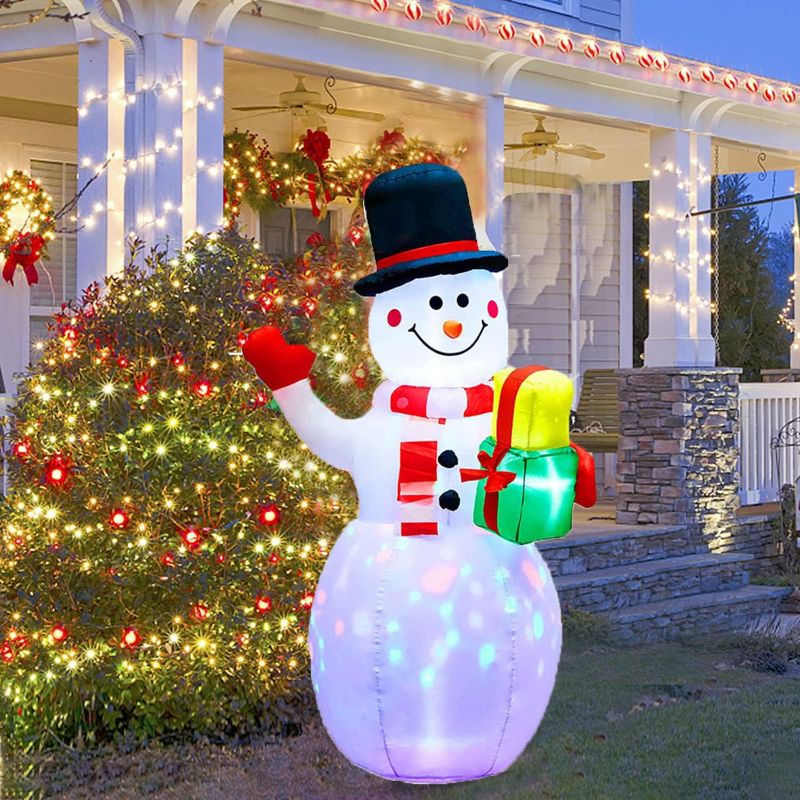 Photo 1 of 5 FT Christmas Inflatables Snowman Outdoor Yard Decorations,Christmas Blow Up Snow Man with Rotating Color Lamp & Gift Box, Christmas Decorations Indoor Outdoor Yard Garden Decorations