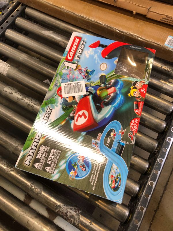 Photo 2 of Carrera First Mario Kart - Slot Car Race Track With Spinners - Includes 2 Cars: Mario and Yoshi - Battery-Powered Beginner Racing Set for Kids Ages 3 Years and Up Mario Kart w/ Spinners