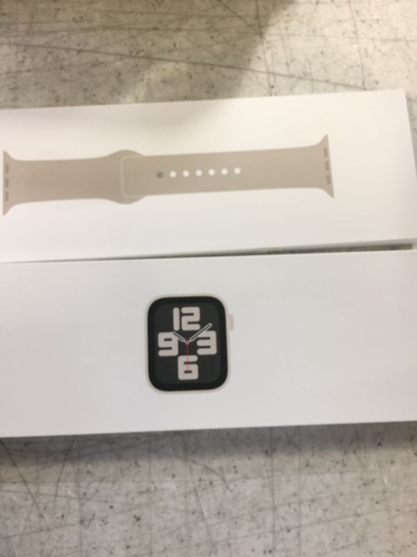 Photo 1 of Apple Watch SE (2nd Gen) [GPS 44mm] Smartwatch with Starlight Aluminum Case with Starlight Sport Band M/L. Fitness & Sleep Tracker, Crash Detection, Heart Rate Monitor Starlight Aluminum Case with Starlight Sport Band 44mm M/L - fits 160–210mm wrists With