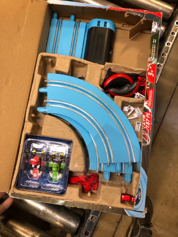 Photo 2 of Carrera First Mario Kart - Slot Car Race Track With Spinners - Includes 2 Cars: Mario and Yoshi - Battery-Powered Beginner Racing Set for Kids Ages 3 Years and Up Mario Kart w/ Spinners