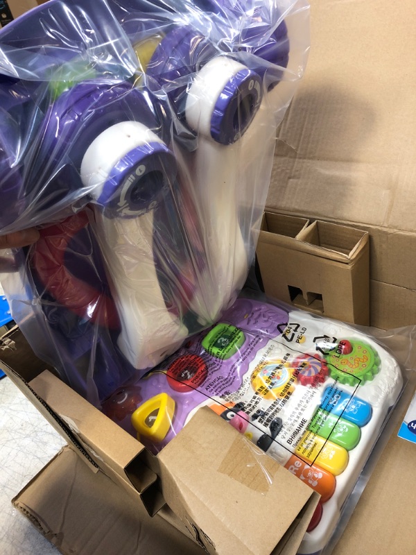 Photo 1 of VTech Sit-to-Stand Learning Walker (Frustration Free Packaging), Lavender (Amazon Exclusive) & Pull and Sing Puppy Lavender Walker + Pull and Sing Puppy