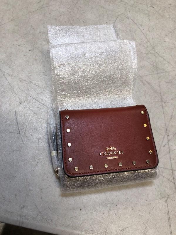 Photo 1 of brown small coach wallet