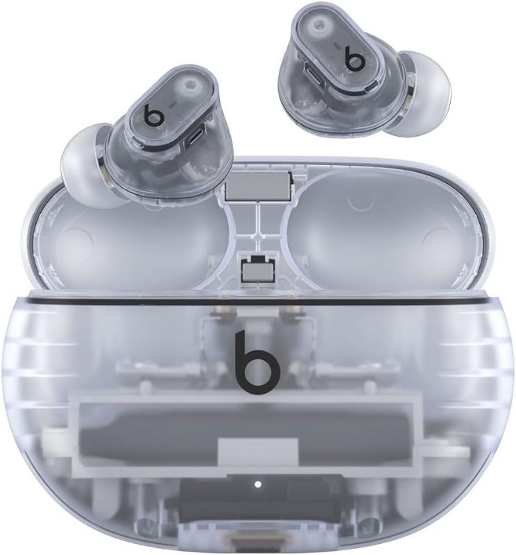 Photo 1 of  Beats Studio Buds + | True Wireless Noise Cancelling Earbuds, Enhanced Apple & Android Compatibility, Built-in Microphone, Sweat Resistant Bluetooth Headphones, Spatial Audio - Transparent 