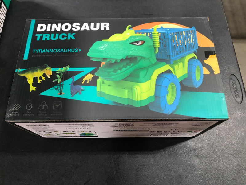 Photo 2 of TEMI Dinosaur Truck Toys for Kids 3-5 Years, Tyrannosaurus Transport Car Carrier Truck with 8 Dino Figures, Activity Play Mat, Dinosaur Eggs, Trees, Capture Jurassic Play Set for Boys and Girls