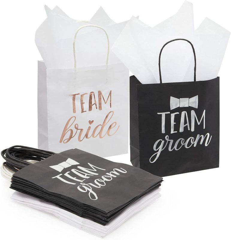 Photo 1 of Juvale 20 Pack Bride and Groom Gift Bags with Tissue Paper for Wedding, Groomsmen, Bridesmaid, Reads Team Bride and Team Groom (8 x 4 x 9 In)
