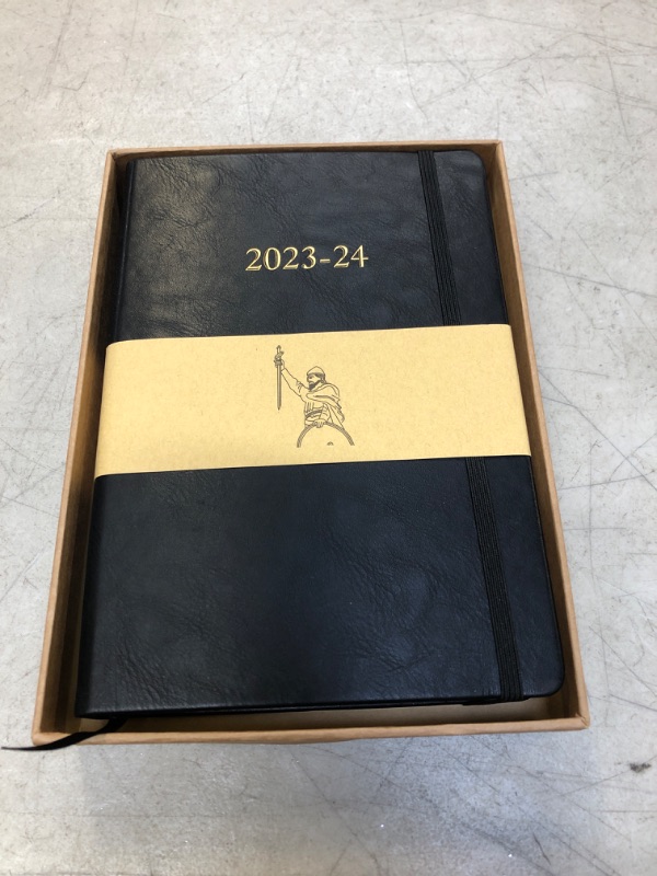 Photo 1 of 2023-2024 planner leather. 