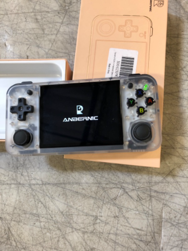 Photo 1 of RG35XX H Handheld Game Console 3.5'' IPS Screen Linux H700 Retro Video Games Player 3300mAh 5528 Classic Games Support Wireless/Wired Controller 5G WiFi Bluetooth Handle H-DMI TV Output (White TR) RG35XX H White Translucent (USED, TURNS ON BUT TURNS OFF)