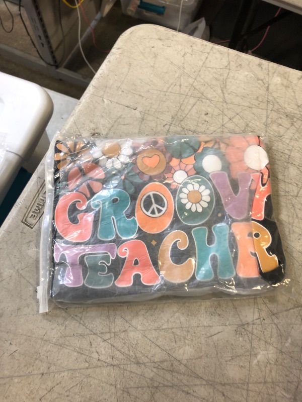 Photo 1 of GROOVY TEACHER T-SHIRT
SIZE MEDIUM 