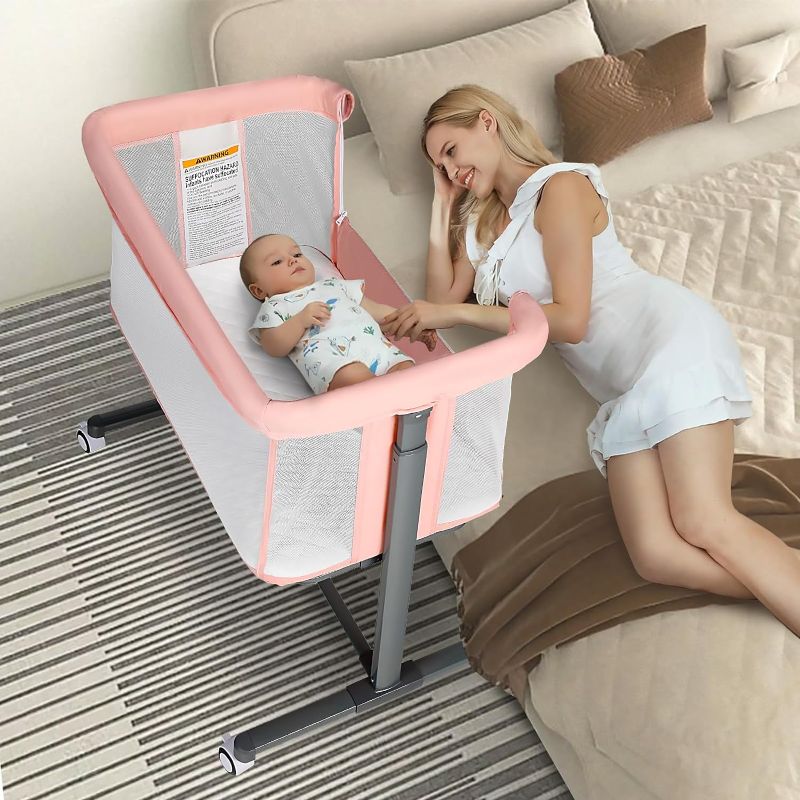 Photo 1 of Kinder King Baby Bassinet w/Wheels, Folding Portable Newborn Bedside Sleeper, All-Sided Mesh Infant Crib, Adjustable Height/Angle, Removable Soft Mattress, No Tool to Assemble, Pink
