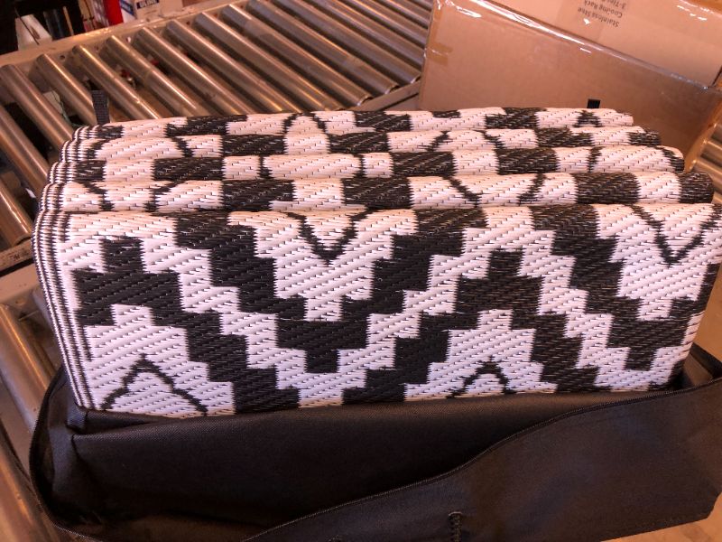 Photo 1 of BLACK AND WHITE PATTERNED STRAW RUG