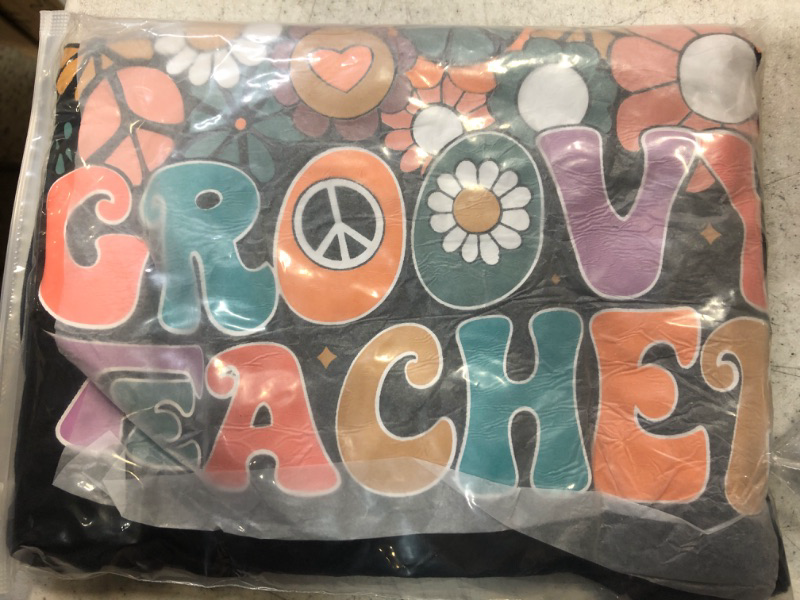 Photo 1 of groovy teacher shirt size large 