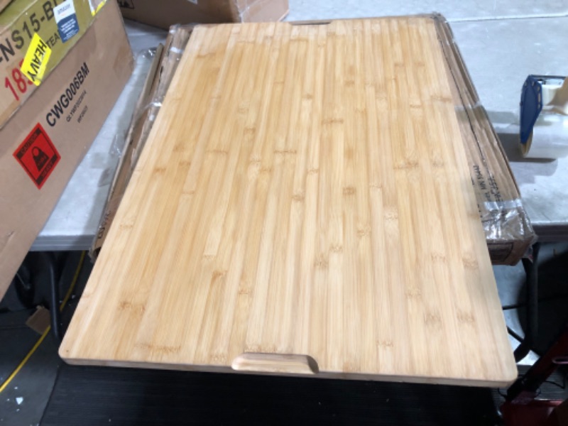 Photo 2 of ***USED - DAMAGED - CORNER CHIPPED - NO PACKAGING - SEE PICTURES***
36 x 24 Extra Large Bamboo Cutting Board for Kitchen, Cutting Board Stove Top Cover with Handle, Butcher Block Chopping Board with Juice Groove, Large Charcuterie Board, Over the Sink Cut